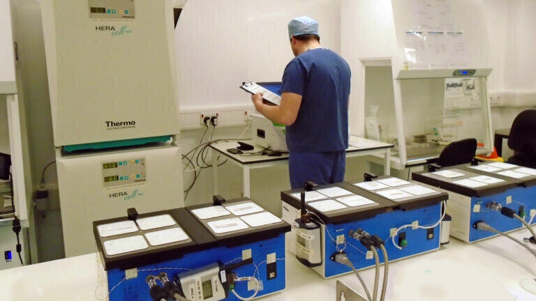 Scientist working with the G100 in a lab